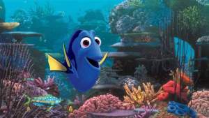 An animated scene from the Pixar film &quot;Finding Dory.&quot; Dory, the central character who is a blue tang, in an underwater coral reef.